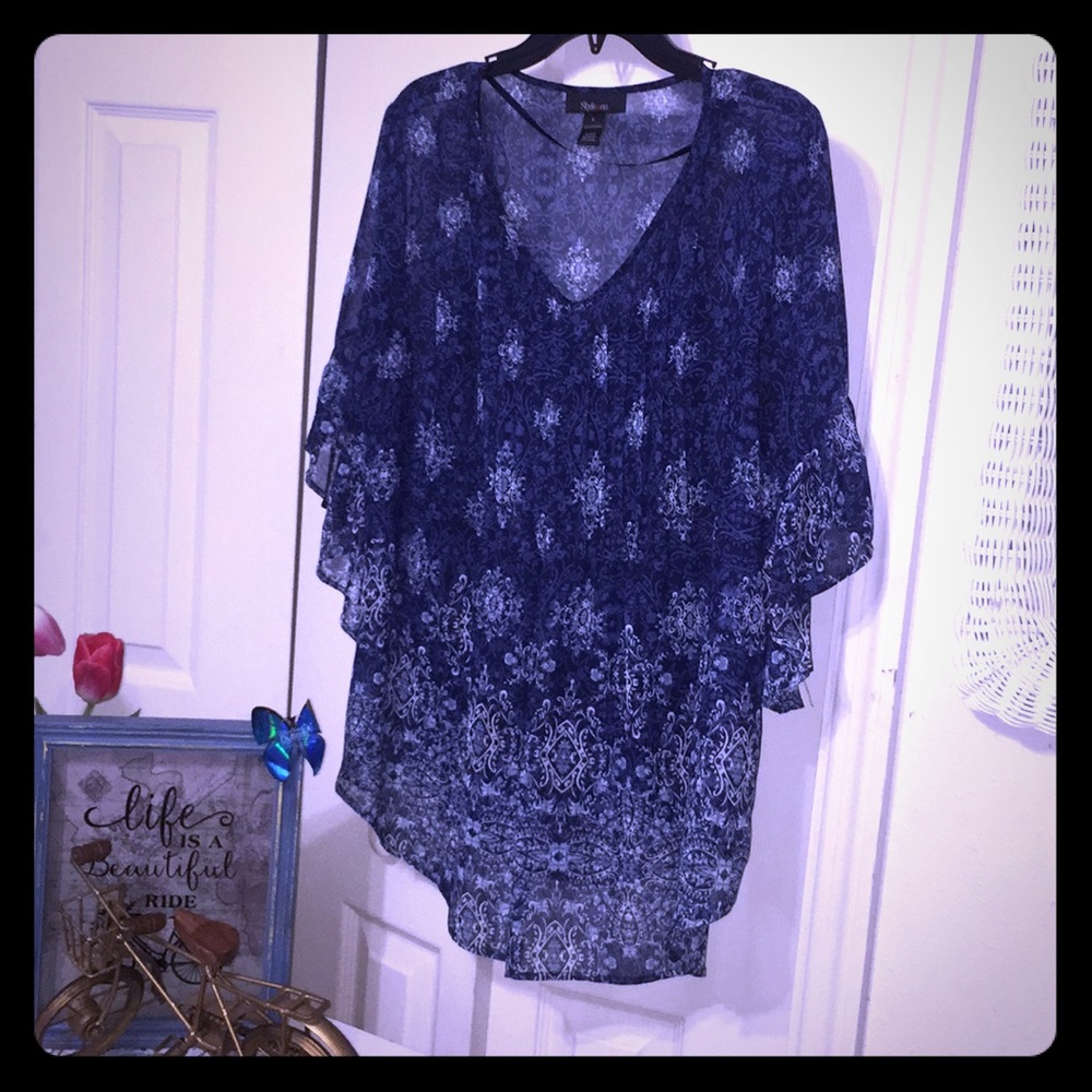 Beautiful blue sheer blouse can be dressy /casual.